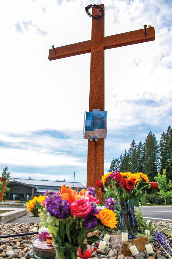 Pastor Bill Douglas of Yacolt Community Church is remembered by a cross located along Amboy Road on church property service on Thursday, May 28. Douglas died from injuries sustained in a motorcycle crash near Yacolt on Wednesday, May 27.