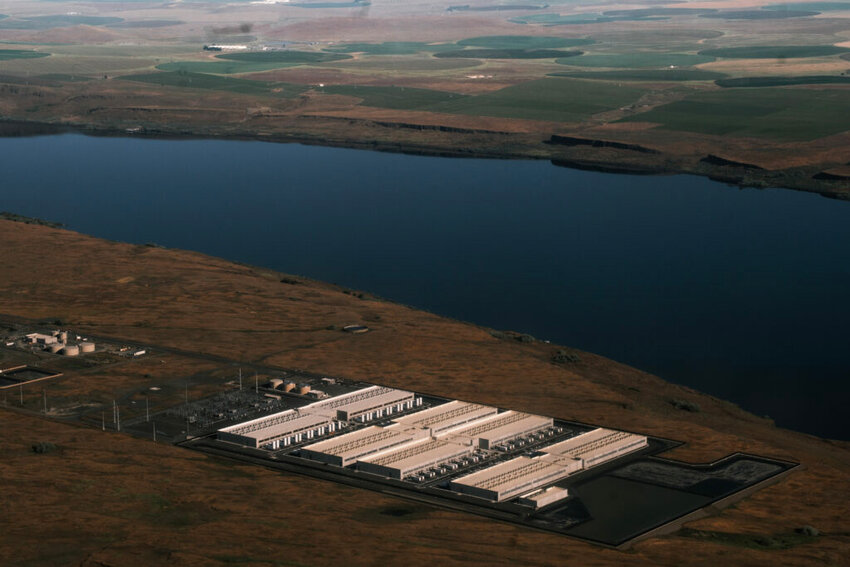 An explosion of data center facilities, including the one pictured here in Umatilla County on May 18, 2026, have been built in Oregon along the Columbia River Gorge during the last few years. The boom has caused a more than 500% load growth for the Umatilla Electric Cooperative during the last decade, which has had to buy more gas and coal-powered electricity on the wholesale market to meet demand. (Photo by Jordan Gale/Oregon Capital Chronicle)
