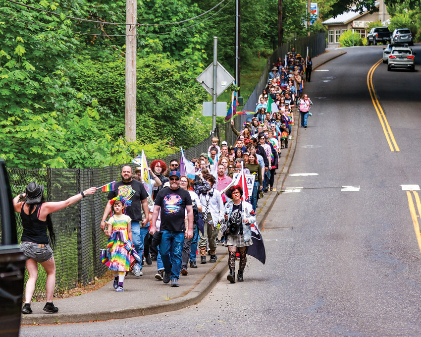 Participants walk through La Center during the Rainbow Walk on Sunday, June 7. The annual event celebrates LGBTQ+ pride and community support.