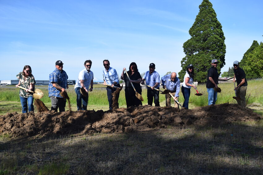 Ridgefield Mayor Matt Cole, city council members and project leaders turn ceremonial shovels of dirt during a Monday, June 1, groundbreaking. The ceremony marked the start of construction on Ridgefield's Eastside Elevated Water Reservoir on South Fifth Street.