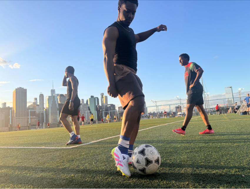 Jonathan Crowder, who lives in Long Island, N.Y., plays a game of pickup soccer at Brooklyn Bridge Park on May 28, 2026. Some World Cup fans are worried about the planned presence of ICE at games.