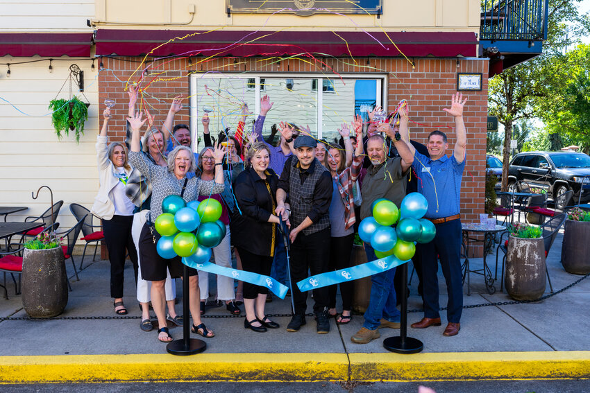 photo by Jaden Davis  Trent and Keary Niarkos, owners of The Savvy Sipper, cut the ribbon at their new business during an event with the Greater Vancouver Chamber of Commerce last week.