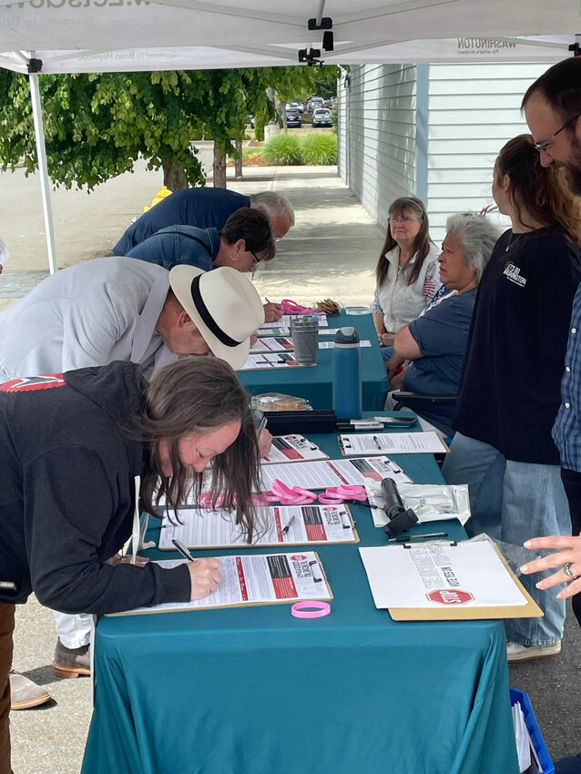 A steady stream of people signed petitions for a proposed ballot measure to repeal Washington&rsquo;s new income tax on high earners. These signatures were gathered in Tumwater in early June by Let&rsquo;s Go Washington, the initiative sponsors.