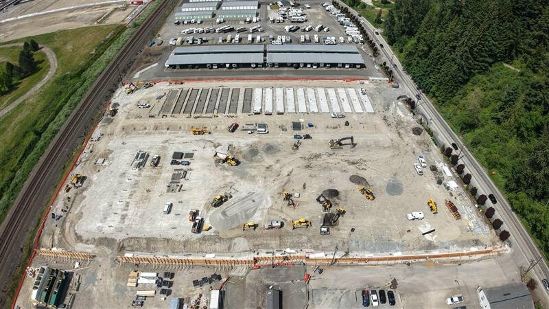 The first large-scale battery energy storage facility in Puget Sound Energy territory is under construction in Sumner, Washington. Developers BrightNight and Cordelio Power expect their Greenwater BESS project (inside the orange fencing) to become operational by the end of 2026. (Photo courtesy of BrightNight Power)