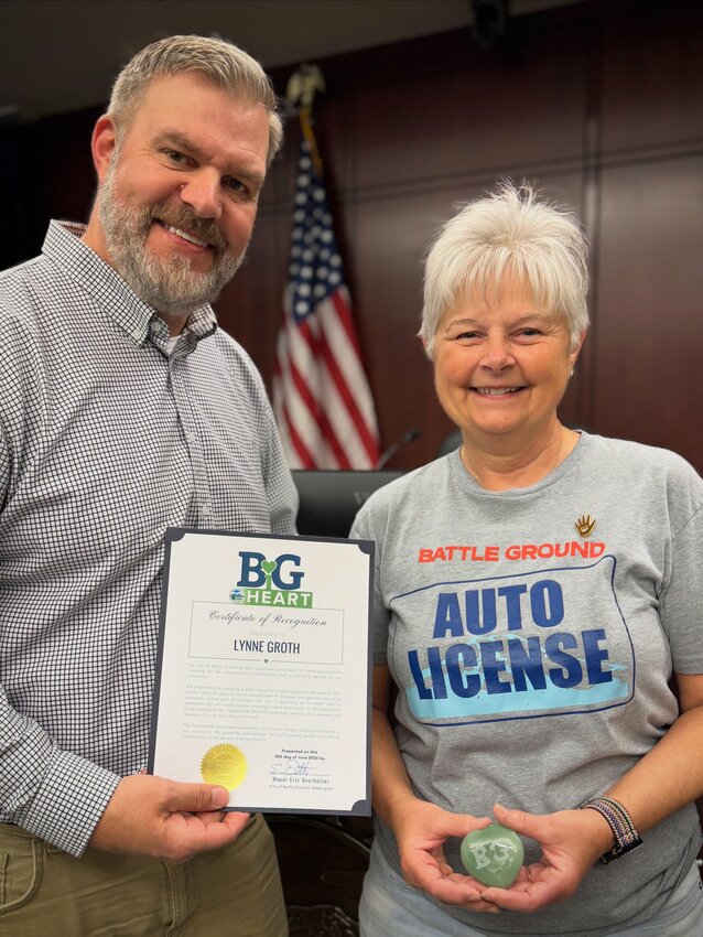 Lynne Groth was honored as the June 2026 recipient of its BiG Heart Award, recognizing her nearly three decades of service to the community through Battle Ground Auto Licensing. She&rsquo;s pictured with Battle Ground Mayor Eric Overholser.