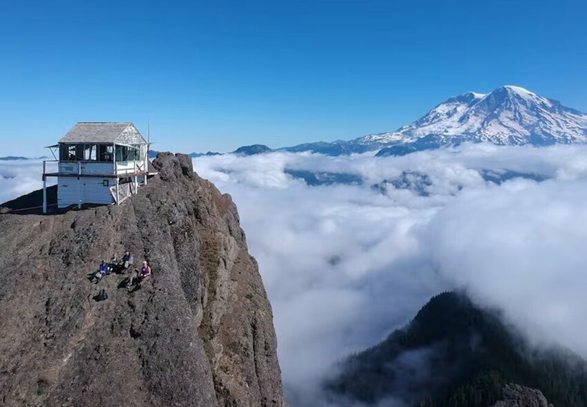 High Rock Lookout, shown here in an aerial drone photo taken by Mary Prophit in 2018, is perched on a 5,685-foot peak, offering visitors a spectacular view of Mount Rainier. It is one of the most popular destinations for hikers in the area.