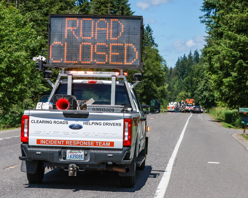 A Washington Department of Transportation Incident Response Team vehicle blocks traffic on state Route 503 near the scene of a three-vehicle crash between Fargher Lake and Battle Ground on Tuesday, June 16.