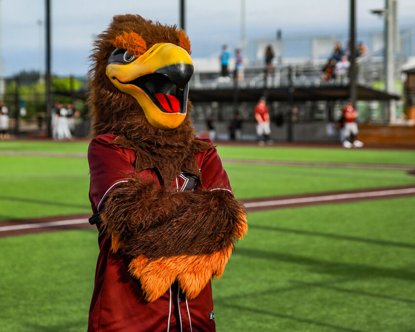 Rally the Raptor stands on the field after being announced during opening day ceremonies for the Ridgefield Raptors on Thursday, May 28.