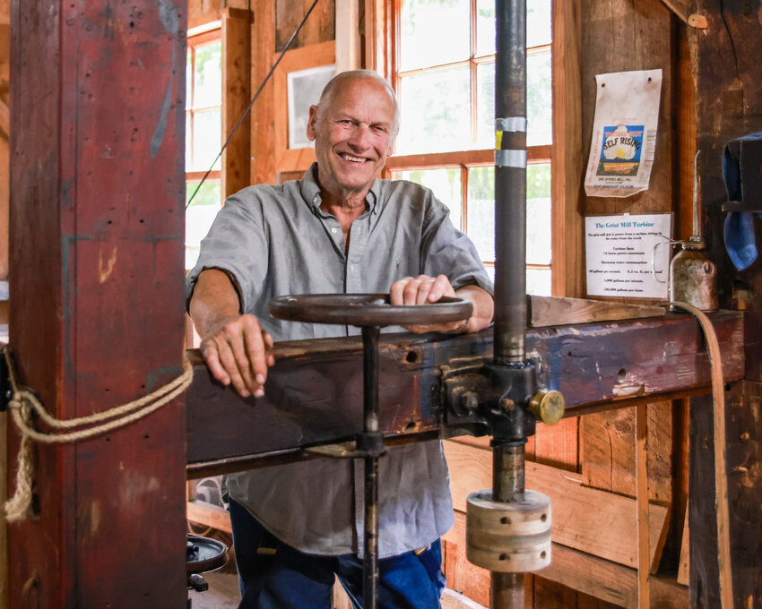 John Clapp, 80, a longtime volunteer at the Cedar Creek Grist Mill, operates the mill during an interview with The Reflector newspaper on Wednesday, June 24.