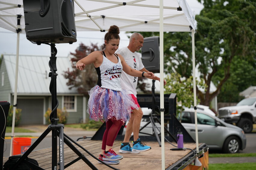 Zumba instructors Rhiannon Anderson and Craig Brown dance with the crowd during the Street Dance on Friday, July 3, at Davis Park.