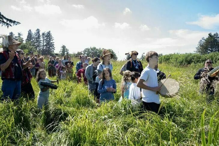 Members of the Chinook Indian Nation drum and sing as the bones of the salmon are returned to the river following the Nation's annual First Salmon Ceremony at Tansy Point in Warrenton on June 19, 2026/