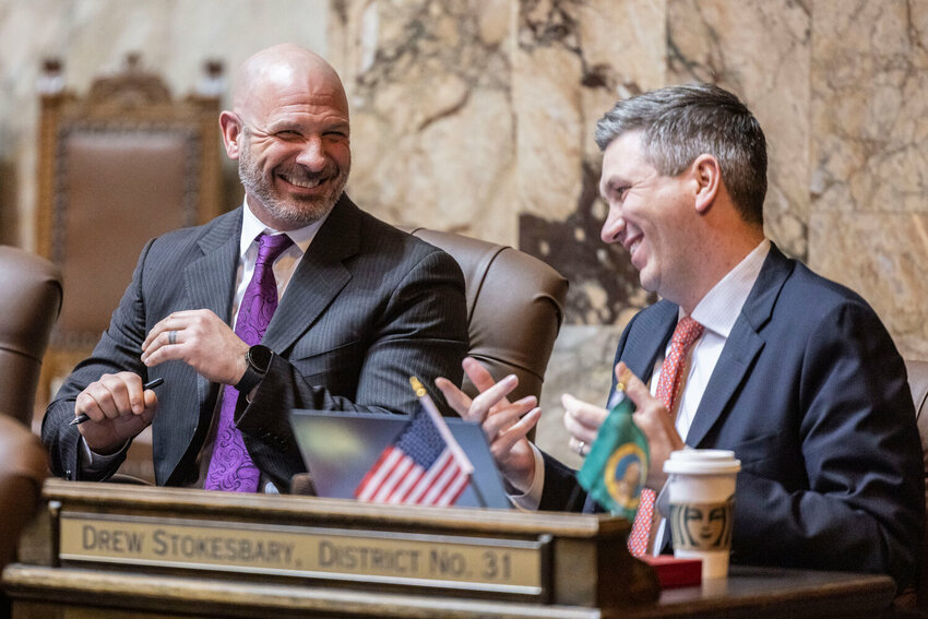 Rep. Peter Abbarno, R-Chehalis, and Rep. Drew Stokesbary, R-Auburn, laugh during a House floor debate on Senate Bill 6346 on Tuesday, March 10, in Olympia.