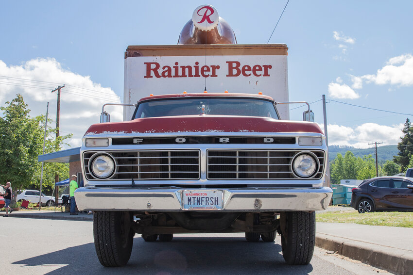 A custom license plate reading mountain fresh is displayed on the front bumper of Woodland resident Perry Schurman&rsquo;s 1973 Rainier Brewing Company Ford F-350 delivery truck on Saturday, July 4, during the City of Vader&rsquo;s Red, White &amp; Boom Car Show.