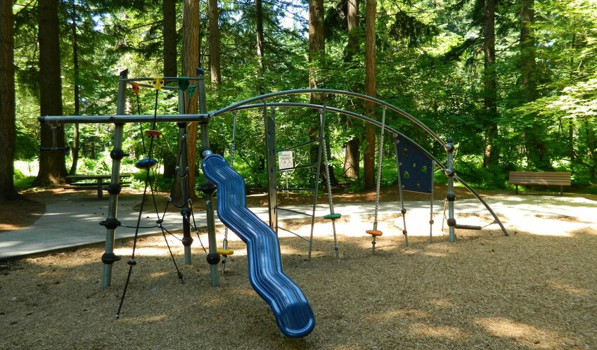 Orchards Community Park, which currently includes forested picnic areas, walking trails, open lawn space, active play areas and a rose garden maintained by the Vancouver Sunrise Rotary Club.