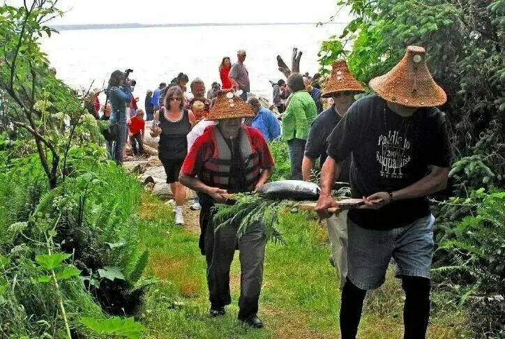 Members of the Chinook Indian Nation carry a ceremonial First Salmon to a gathering at Chinook Point in Fort Columbia State Park in 2011.