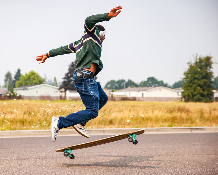 Battle Ground longboard dancer Ke'Vionne &ldquo;Kiwi&rdquo; Robbins performs a trick on Rasmussen Boulevard on Wednesday, Aug. 5.
