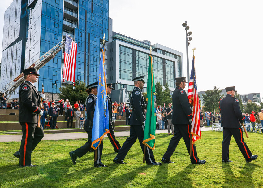 A combined Vancouver Police and Vancouver Fire color guard goes to post the colors ahead of a 9/11 remembrance ceremony at the Vancouver waterfront on Friday, Sept. 11.