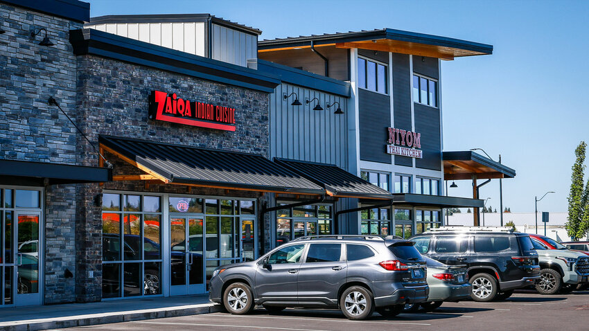 Workers of Zaiqa Indian Cuisine take time to eat food between the lunch and dinner rush in Ridgefield on Wednesday, Sept. 16.