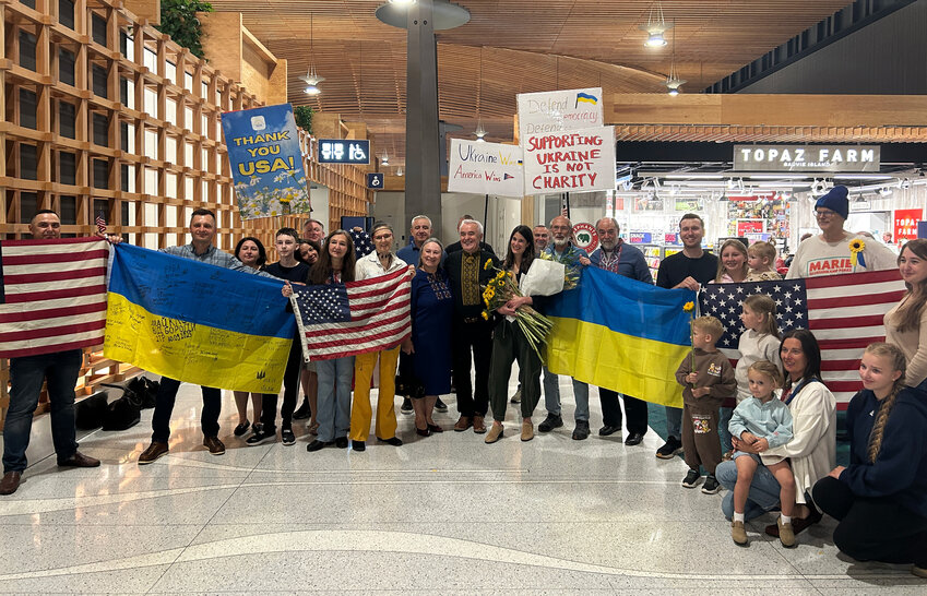 Members of the Southwest Washington Ukrainian community welcome U.S. Rep. Marie Gluesenkamp Perez at Portland International Airport after she voted to advance a package of sanctions on Russia.