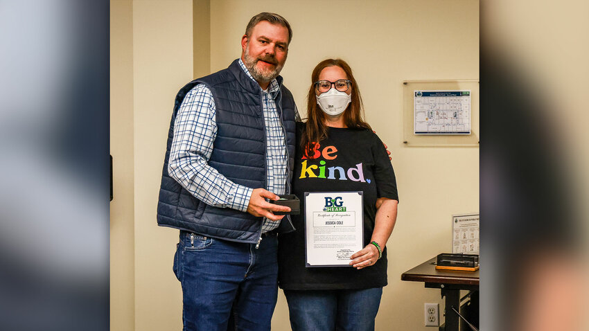 Attendees of the Sept. 21 Battle Ground City Council meeting begin to stand and applaud as Battle Ground community member Jessica Cole is honored with the city&rsquo;s BiG Heart award.