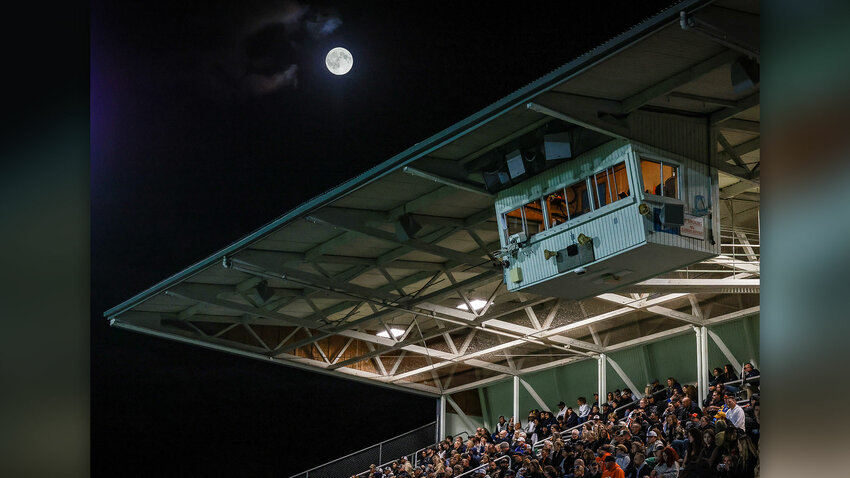 An almost-full moon rises over Woodland High School on Friday, Sept. 25.