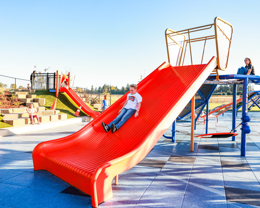 Elliott, a fifth-grade student, enjoys a large slide at the playground at Sunset Ridge Elementary School in Ridgefield on Thursday, Oct. 15.