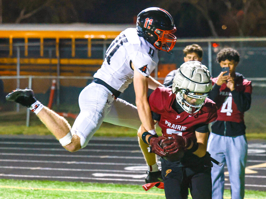 Prairie sophomore quarterback Nolan Brame throws a touchdown pass in the Falcons&rsquo; 21-17 win over Shelton High School on Friday, Oct. 23.